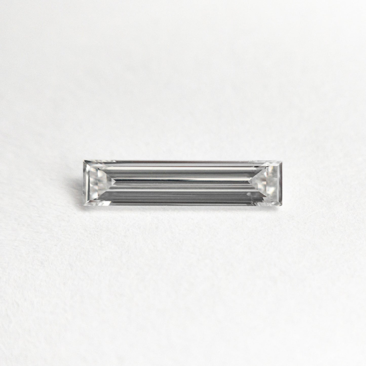 0.25ct 9.05x2.06x1.24mm VS1 E バゲット ステップカット 24701-07