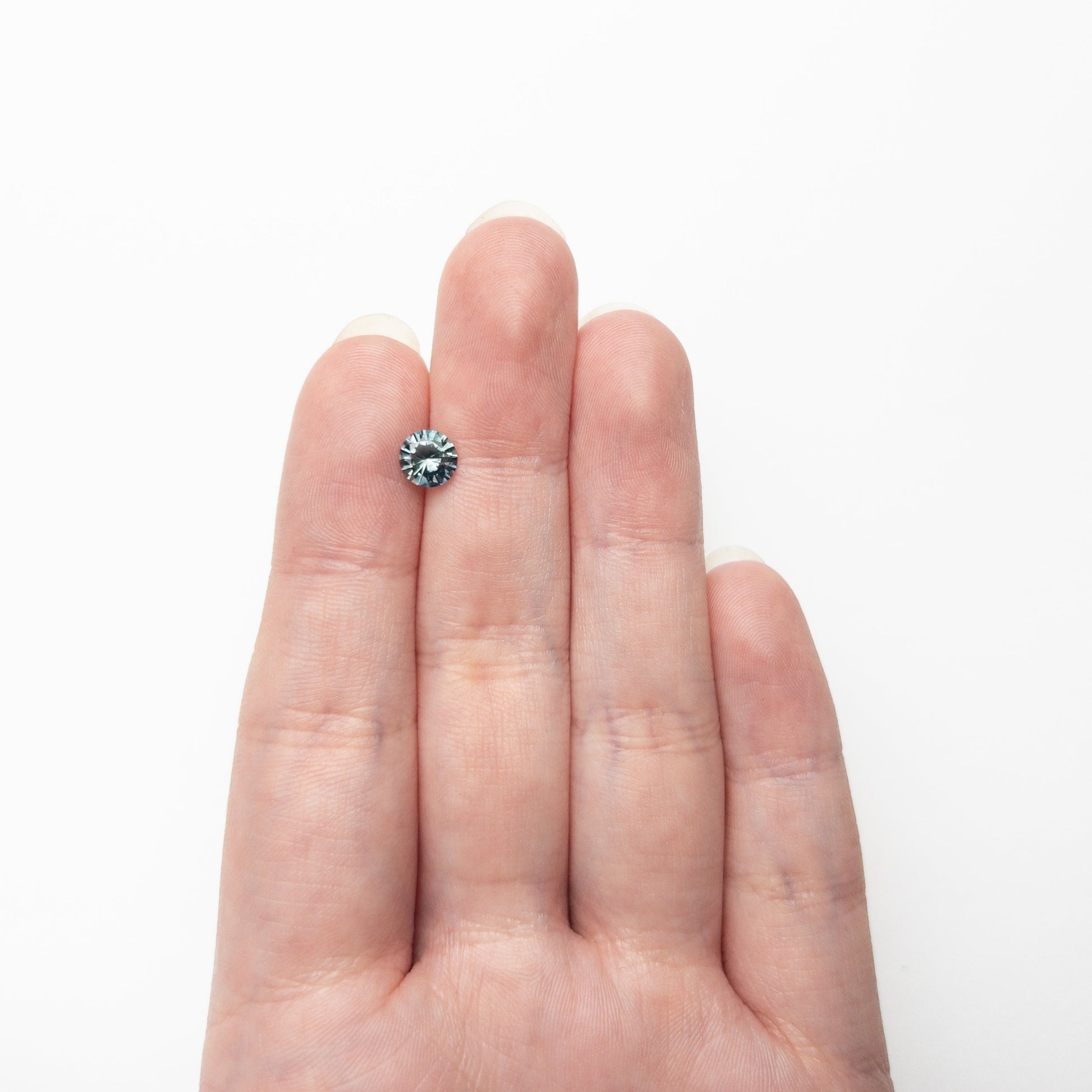 1.04ct 6.10x6.07x3.89mm ラウンドブリリアントサファイア 26141-25
