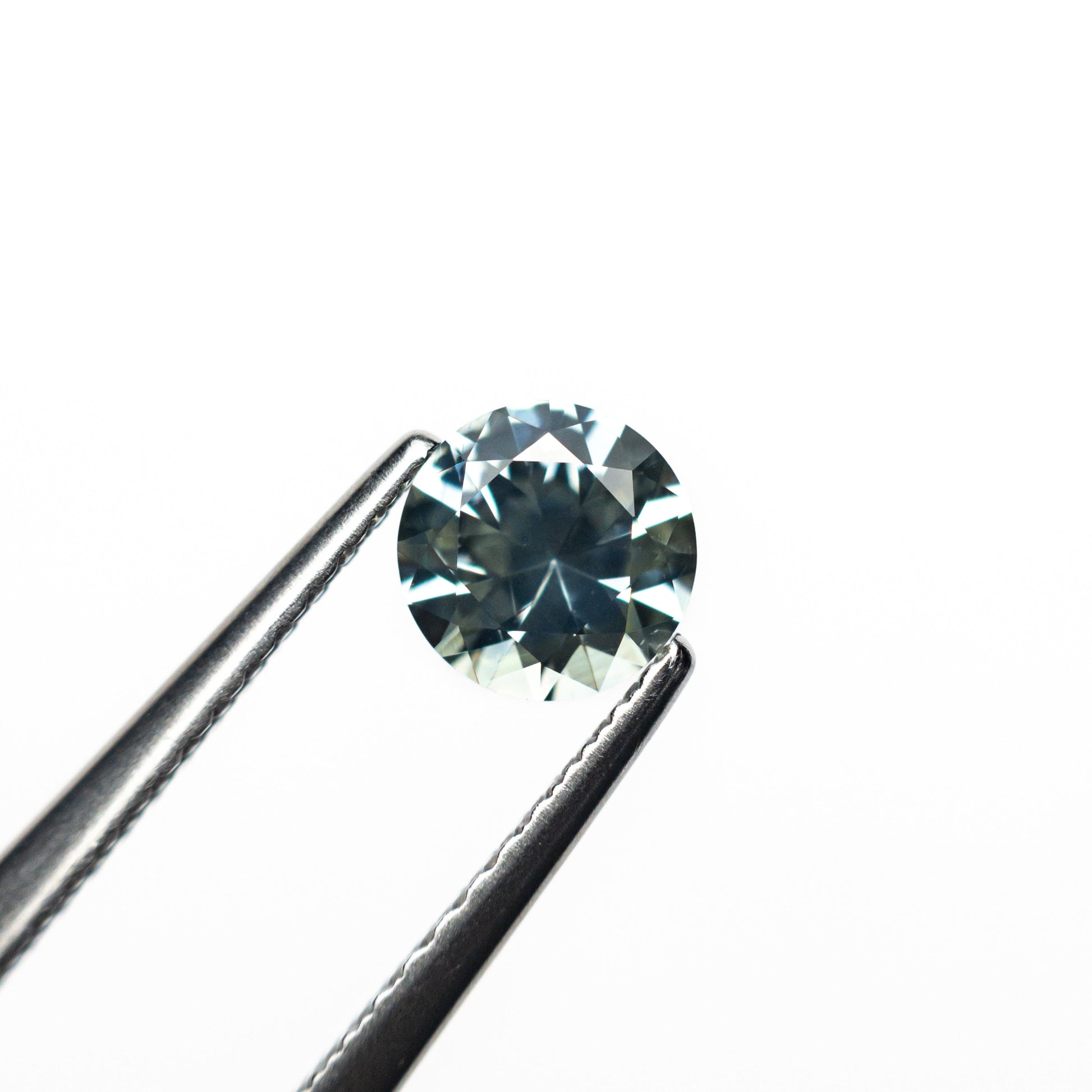 0.66カラット 5.20x5.17x3.33mm ラウンドブリリアントサファイア 26556-12