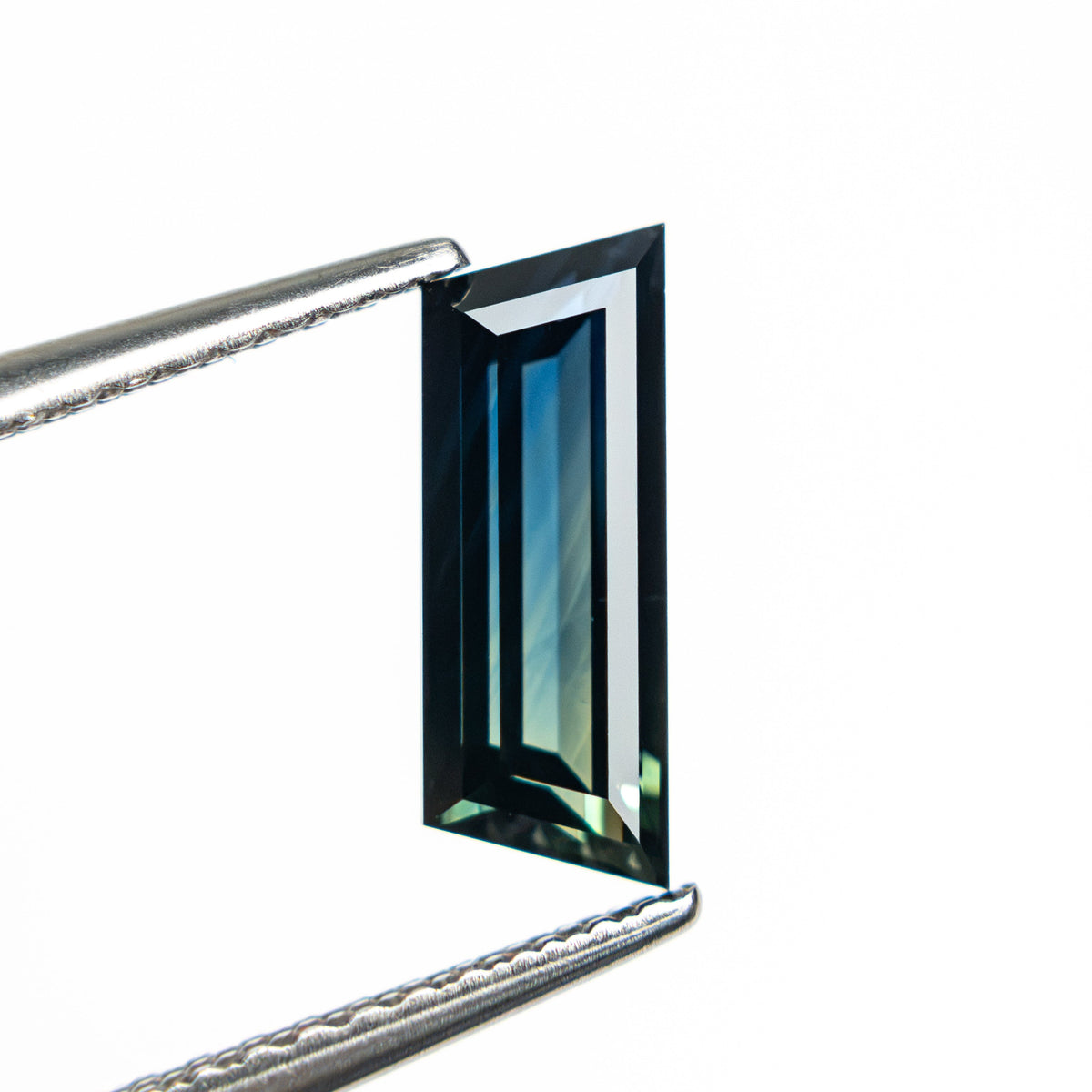 1.31ct 10.46x3.86x2.76mm Trapezoid Step Cut Sapphire 27766-11