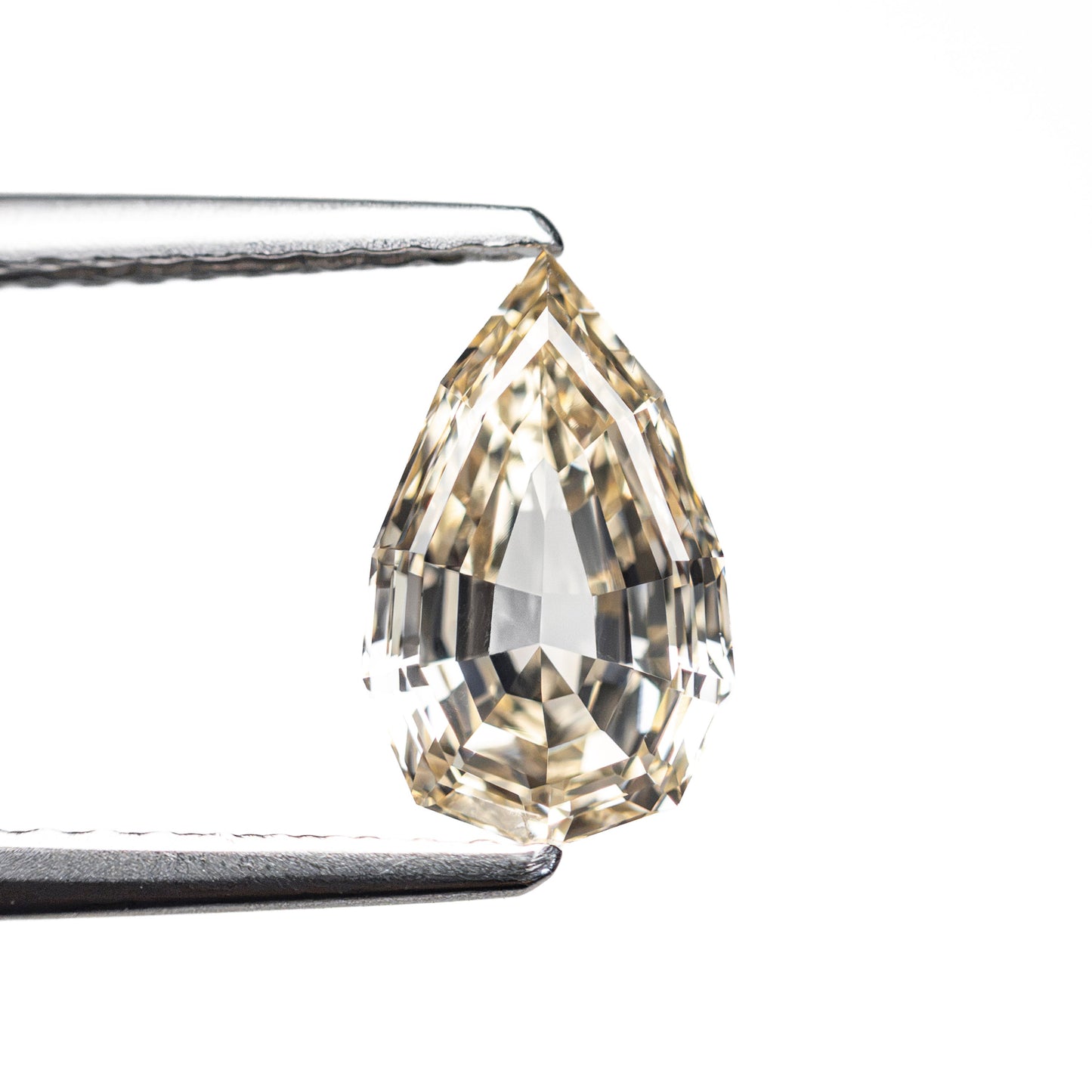 1.21ct 9.11x5.57x3.36mm VVS2 Fancy Light Yellowish Brown Geo Pear Step Cut 28047-01